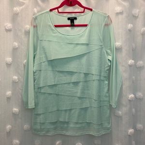 Baby green long sleeve tee. Sleeves are nylon